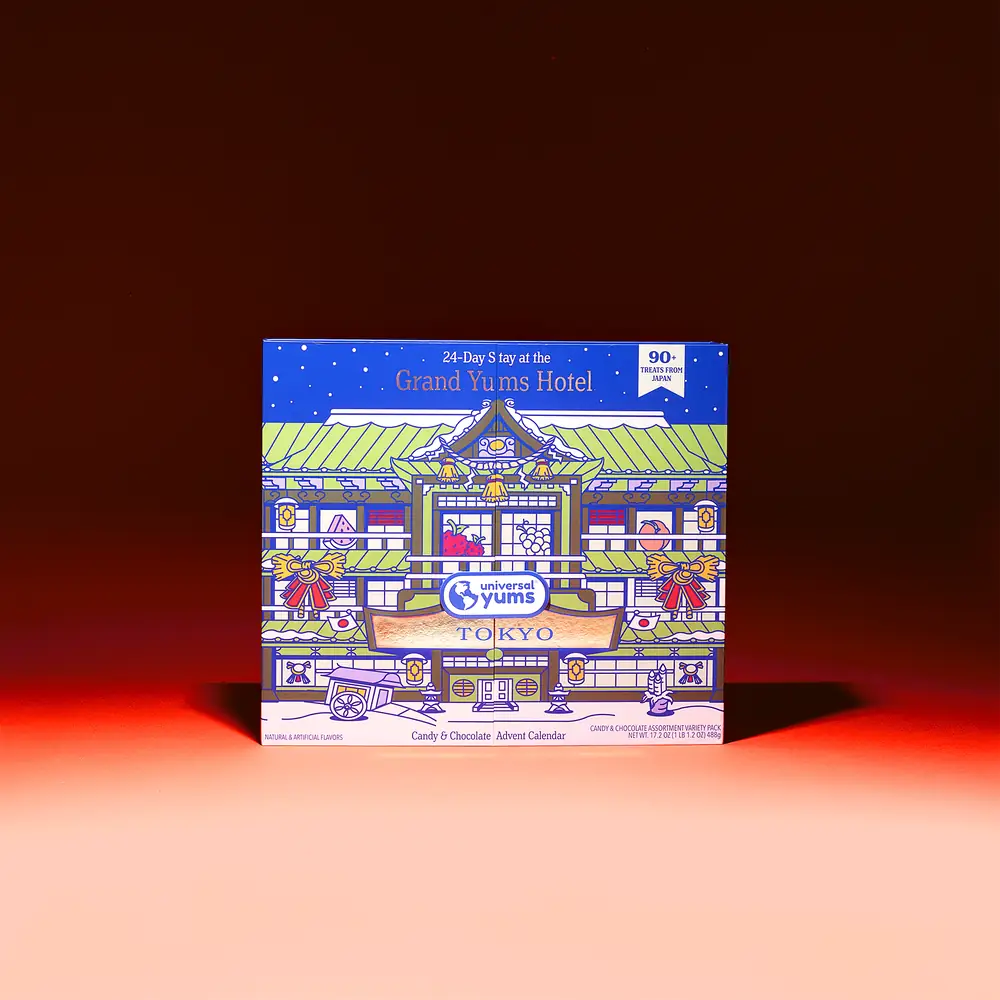 The Grand Yums Hotel Tokyo advent calendar opens, then a few of its doors open to show the treats inside.