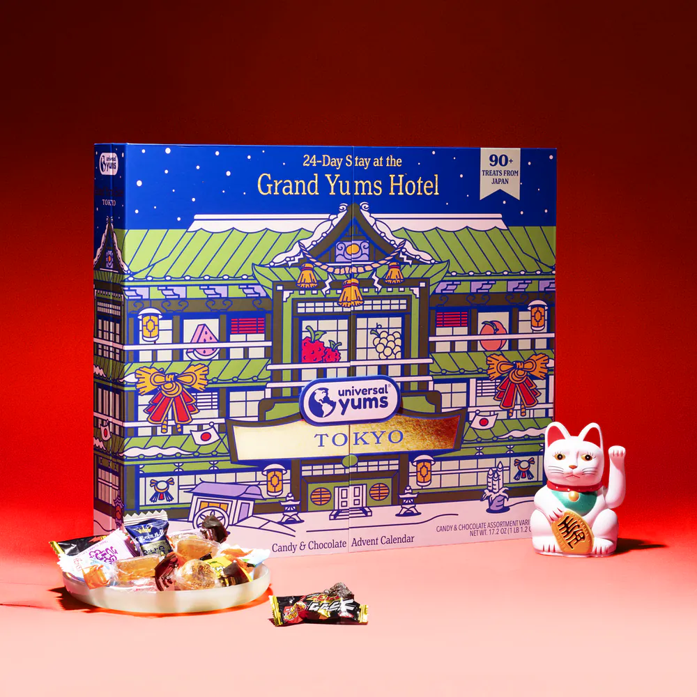 The Grand Yums Hotel Tokyo advent calendar with a bowl of Japanese candy and a lucky cat.