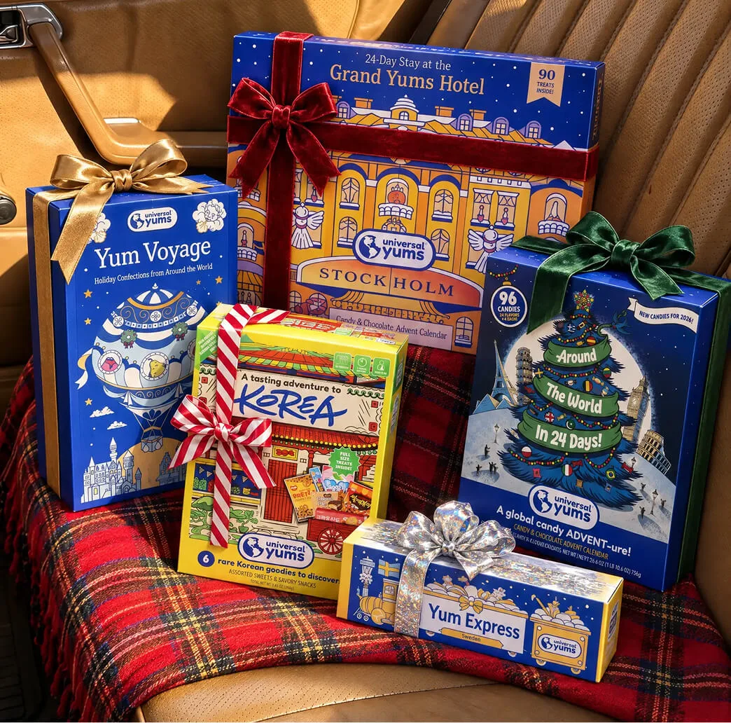 Wrapped Universal Yums holiday gift boxes stacked on the back seat of a car.