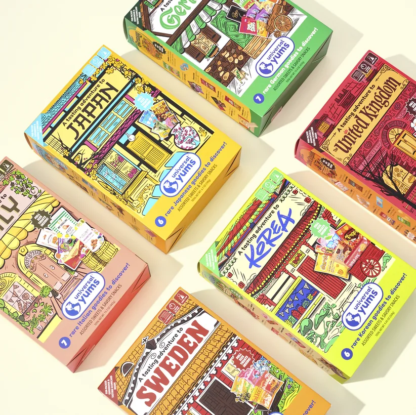 The six tasting set boxes laid out at an angle on a cream background.