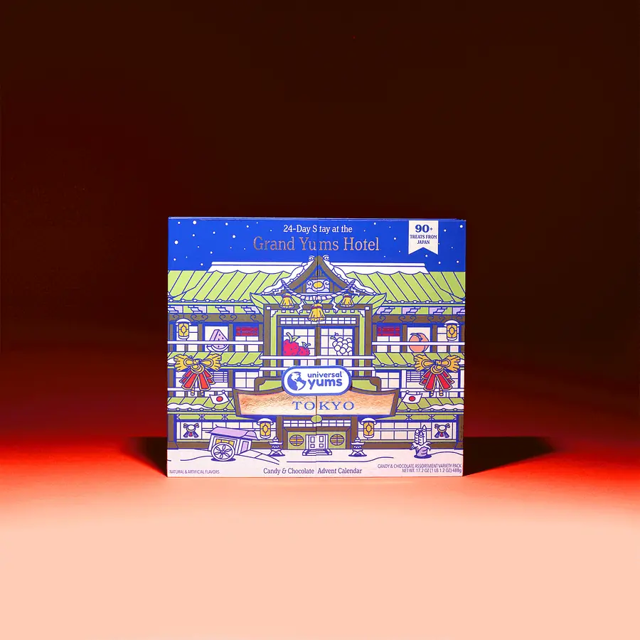 The Grand Yums Hotel Tokyo advent calendar on a red background, unfolding to show its numbered doors and the candies behind them.