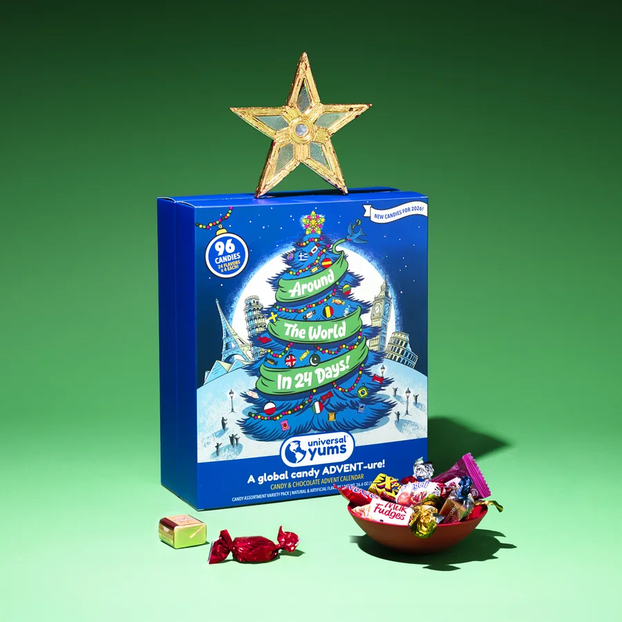 The Around The World Candy Advent Calendar with a gold star on top, beside a bowl of wrapped candies.